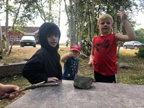 Three young students outdoors