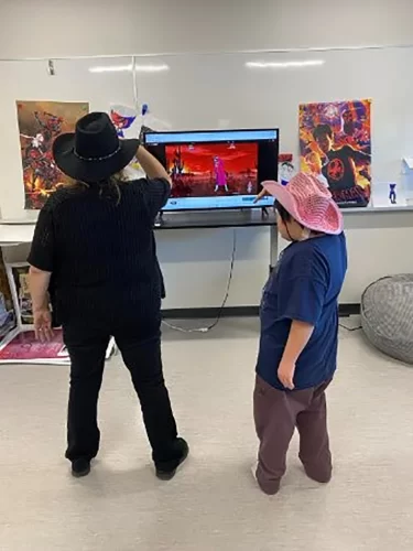 Special education student plays a video game.